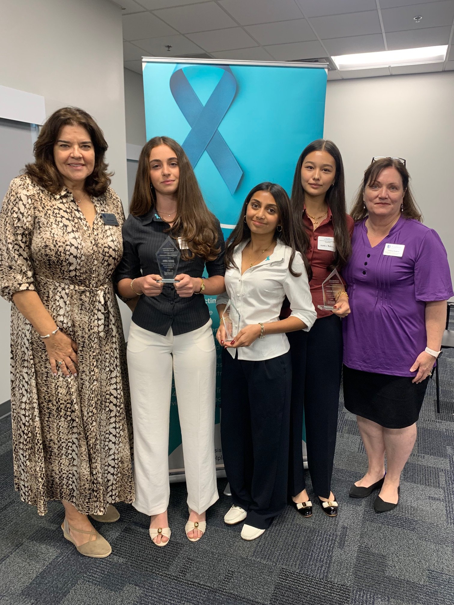 Group photo with Community Service Award honorees and presenters